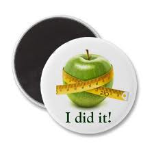 badge with apple and tape measure